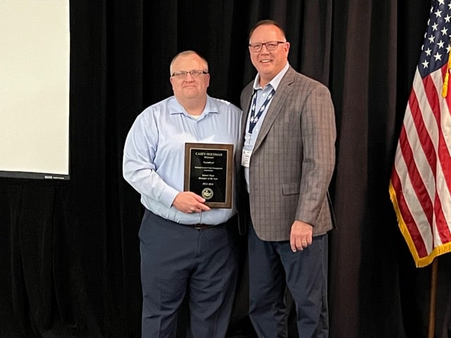 Casey Housman, receiving the 2024 NSPMA Plant Manger of the Year Award from Charley Branham, Executive Director of Missouri School Plant Management Association.
